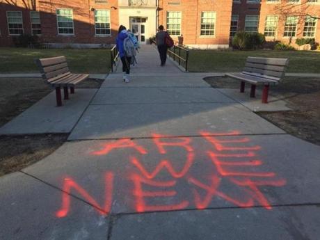As students trickled into the entrance to begin their day, they were greeted by the words ?ARE WE NEXT? in bold, orange letters, painted on the sidewalk.
